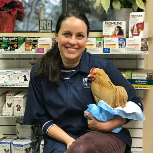 Tara with a patient during her time in general veterinary practice in the United States